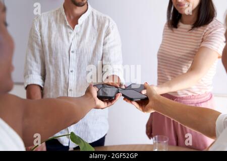 Creative male and female colleagues with mobile phones at office Stock Photo