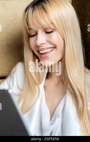 Happy young female professional using digital tablet Stock Photo