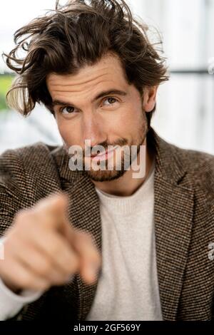 Businessman pointing at camera Stock Photo