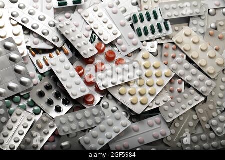 Large range of medicines. Plates with various pills and capsules. texture or background. Stock Photo