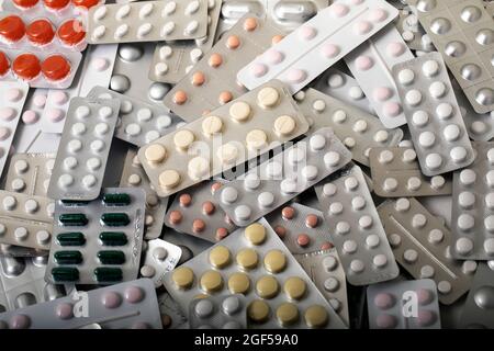 Large range of medicines. Plates with various pills and capsules. texture or background. Stock Photo