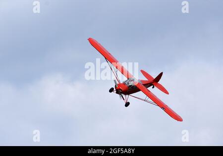 Vintage 1961 Piper Super Cub in flight close up. Stock Photo