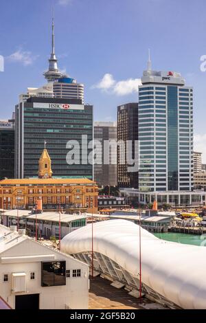 HSBC Bank Building And Historic Downtown Ferry Building In Auckland City Centre Sky Tower In The Background Cruise Port Terminal New Zealand Vertical Stock Photo