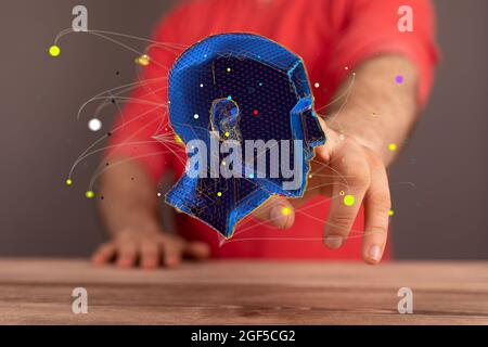 Man holding an abstract polygonal 3D human head Stock Photo