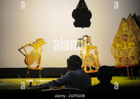 Wayang kulit show from the Java area. In Indonesia, there are several regions that have wayang kulit art with their own characteristics. Stock Photo