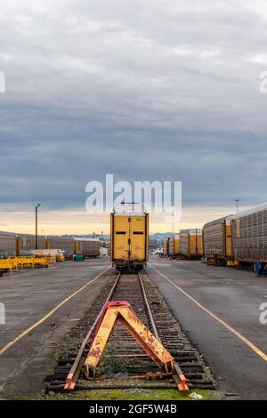 Train Car at the End of a Track in a Railyard Stock Photo