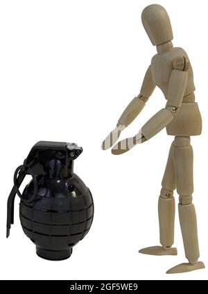 Grabbing for a black grenade Stock Photo