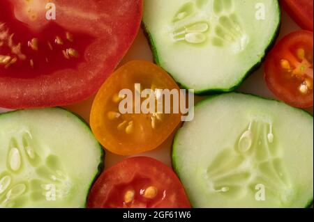 Cucumber, Red and Yellow Tomato Slices, Close Up Stock Photo