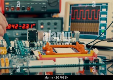 Development of the design of an electronic device in the laboratory of semiconductor electronics Stock Photo