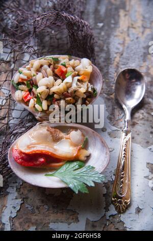 Presentation of the risotto warm to Fasolaro co parsley and garlic Stock Photo