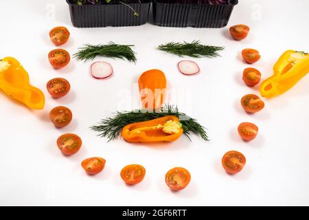 A person's face made of vegetables on a white background. Stock Photo