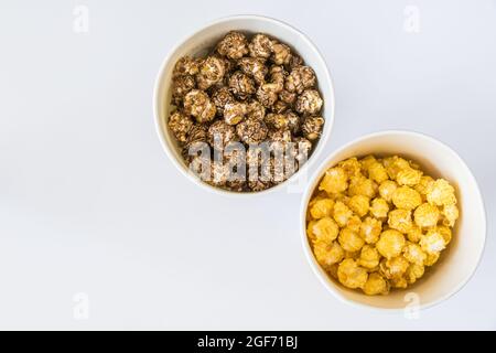 Top view of sweet popcorn in bowls on a white background Stock Photo