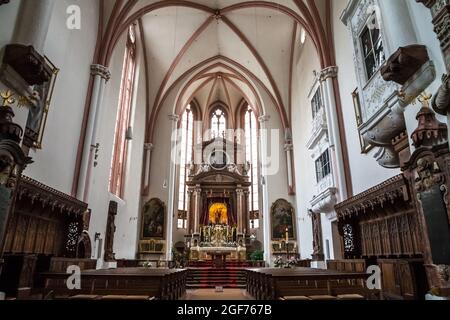 Nice view of the marble high altar made by Bartholomäus van Opstal and the side altars inside the collegiate church of St. Peter and John the Baptist... Stock Photo