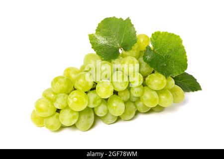 cluster of grapes with green leaves isolated on white background Stock Photo
