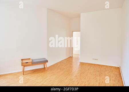 Empty bright Berlin room in an old apartment in Berlin with parquet as a walk-through room Stock Photo