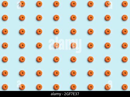 Halloween. Seamless pattern of pumpkins on a blue background. Stock Photo