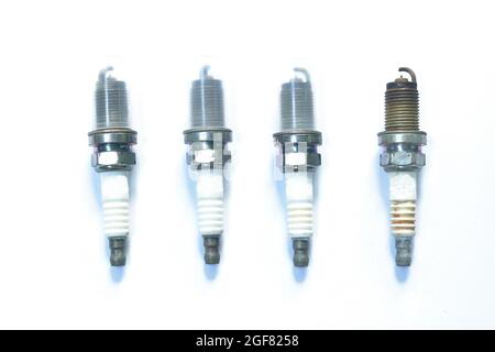 old car spark plug arranging on white background Stock Photo
