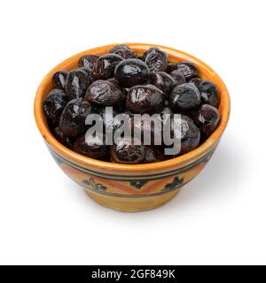 Bowl with traditional Moroccan black breakfast olives close up isolated on white background Stock Photo