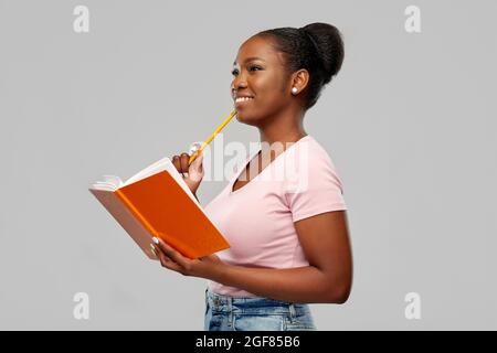 happy african american woman with notebook Stock Photo
