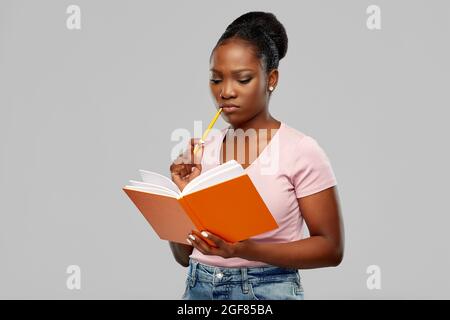 african american woman with notebook Stock Photo