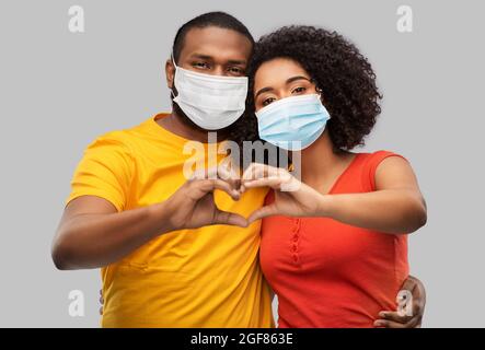 african american couple in medical masks Stock Photo