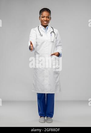 african american female doctor making handshake Stock Photo