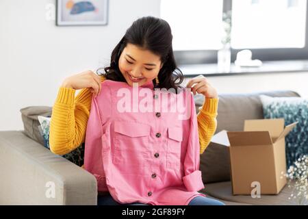 happy asian young woman with parcel box at home Stock Photo - Alamy