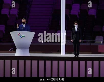 Tokyo, Japan. 24th Aug, 2021. International Paralympic Committee (IPC) president Andrew Parsons (L) speaks during the opening ceremony of Tokyo 2020 Paralympic Games in Tokyo, Japan, Aug. 24, 2021. Credit: Hu Huhu/Xinhua/Alamy Live News Stock Photo