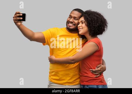 african american couple taking selfie by cellphone Stock Photo