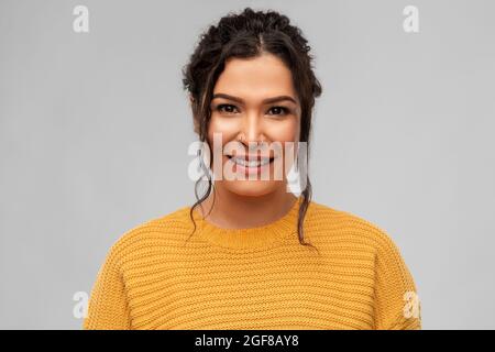 happy smiling young woman with pierced nose Stock Photo