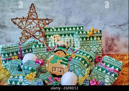 Wrapped gifts that are part of an advent calendar and Christmas decorations. Stock Photo