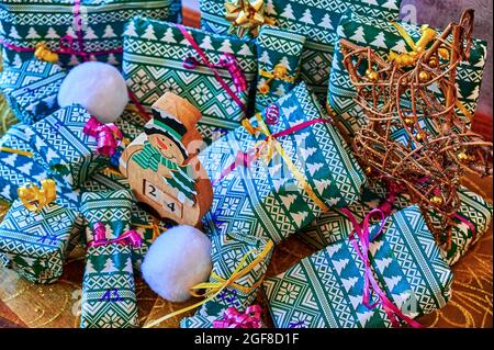 Wrapped gifts that are part of an advent calendar and Christmas decorations. Stock Photo
