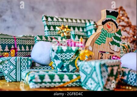 Wrapped gifts that are part of an advent calendar and Christmas decorations. Stock Photo