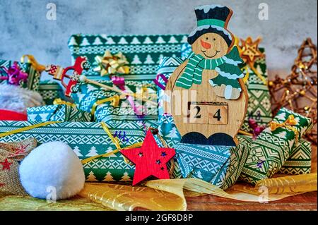 Wrapped gifts that are part of an advent calendar and Christmas decorations. Stock Photo