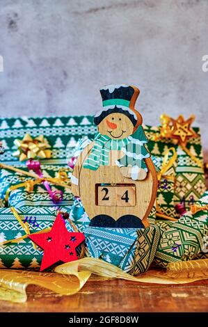 Wrapped gifts that are part of an advent calendar and Christmas decorations. Stock Photo