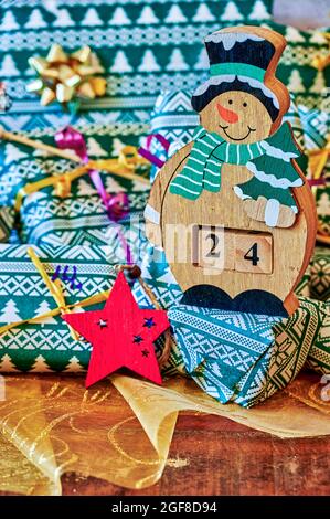 Wrapped gifts that are part of an advent calendar and Christmas decorations. Stock Photo