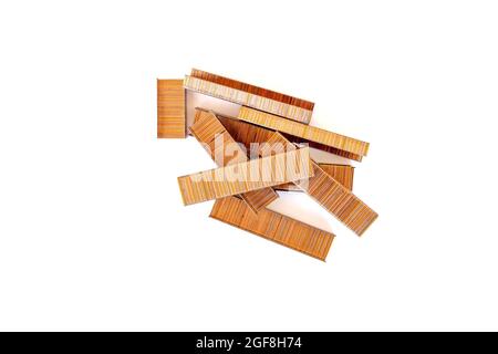Brown staples isolated on white background. Top view, flat lay. Stock Photo