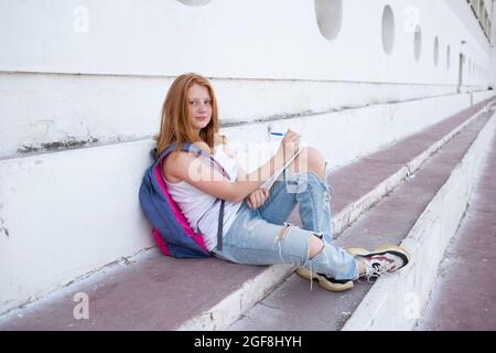 Teenage Girl Draws Sketchbook While Sitting Stock Photo 2034569108