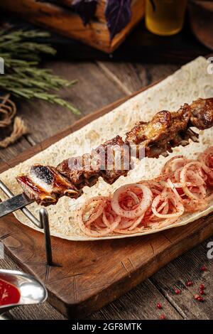 Grilled georgian lamb ribs shashlik skewers Stock Photo