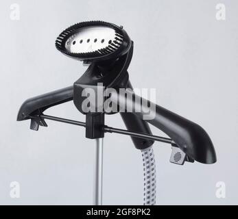 Steamer for clothes on the hanger isolated on white background Stock Photo