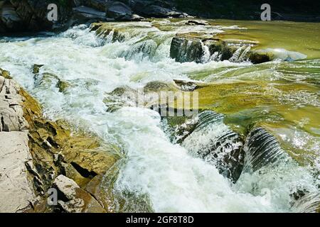 Waterfall on the mountain river Stock Photo