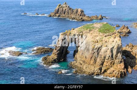 The Armed Knight and Enys Dodnan rocks off the coast of Lands End, Cornwall, England, UK Stock Photo