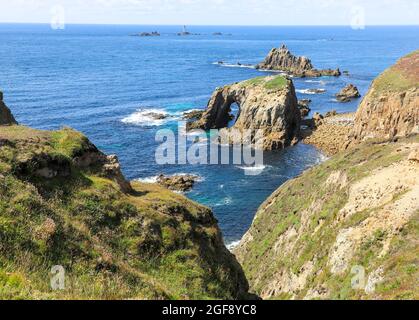 The Armed Knight and Enys Dodnan rocks off the coast of Lands End, Cornwall, England, UK Stock Photo