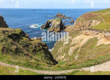 The Armed Knight and Enys Dodnan rocks off the coast of Lands End, Cornwall, England, UK Stock Photo