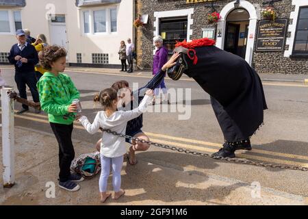 Laurence Bond with his Hooden Horse interacting with people during Broadstairs Folk Week, August 2021 Stock Photo