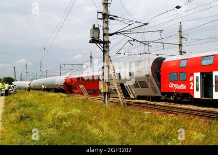 Gramatneusiedl, Austria - July 27, 2005: Unidentified people for damage expertise after train accident with wrecked wagons Stock Photo
