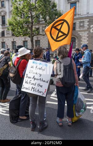 Extinction Rebellion protest down Whitehall in protest against HMRC and Barclays. London - 24th August 2021 Stock Photo