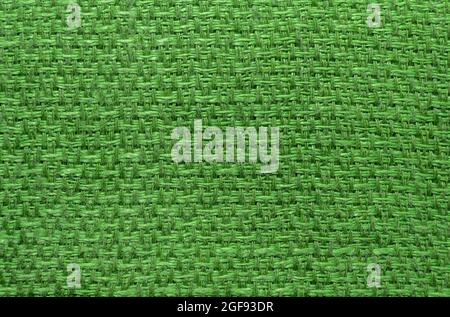 Textile. The texture is green with straight lines and weave. Close-up of household towel material Stock Photo