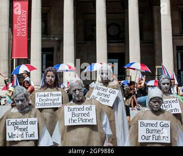 August 24, 2021, London, England, UK: Extinction Rebellion Penitents' march through London City Centre, from Piccadilly to Parliament Square..The group hopes to ''bring a deeply contemplative mood to the rebellion'' to ''open the minds and hearts of those they pass''. Based on the Medieval idea of atonement for transgressions against the community, penitents carry the burden of all human crimes. .â€œPenitents are downcast, never speak, their movements are extremely slow, hands by sides, palms facing forward, fingers toward the earth. (Credit Image: © Sabrina Merolla/ZUMA Press Wire) Stock Photo