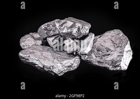 Palladium is a chemical element that at room temperature contracts in the solid state. Metal used in industry. Mineral extraction concept. Stock Photo